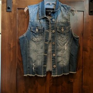 Sleeveless distressed denim vest